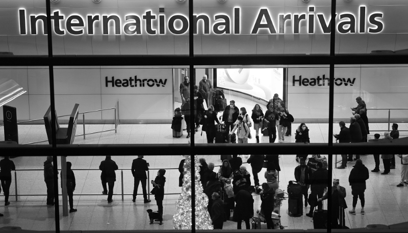 Passengers arrive at London Heathrow airport in January 2023.