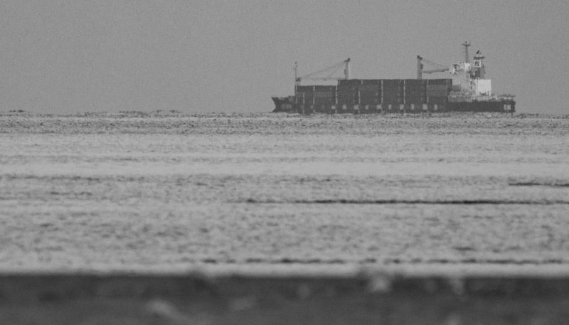 The container ship Kota Rahmat, with the destination 'VSL NO LINK ISRAEL', approaches the Bab el-Mandeb Strait on 18 January 2024 in Obock, Djibouti.