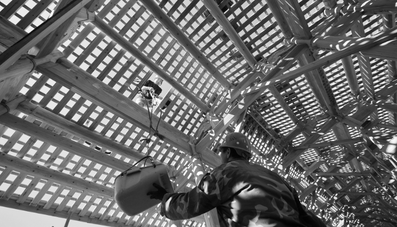 Workers restoring the roof of the wooden Wan'an Bridge in Fujian Province, China, on 29 November 2023. In December 2024, UNESCO added China's traditional practice of building wooden arch bridges to its intangible cultural heritage list.