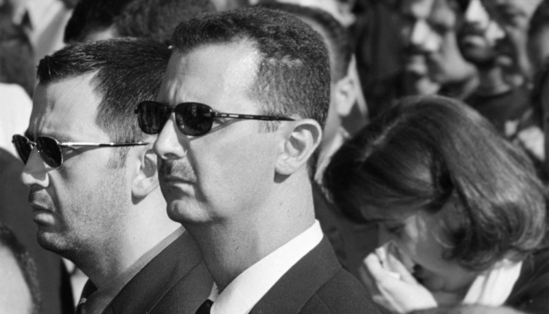 Archive photo of Bashar al-Assad (right) and his younger brother Maher (left) at the state funeral of their father Hafez al-Assad in Damascus on 13 June 2020.